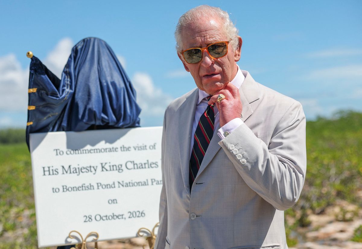 King Charles III unveils a plaque as he plants a silver buttonwood tree at Bonefish Pond National Park in New Providence during his visit to The Bahamas