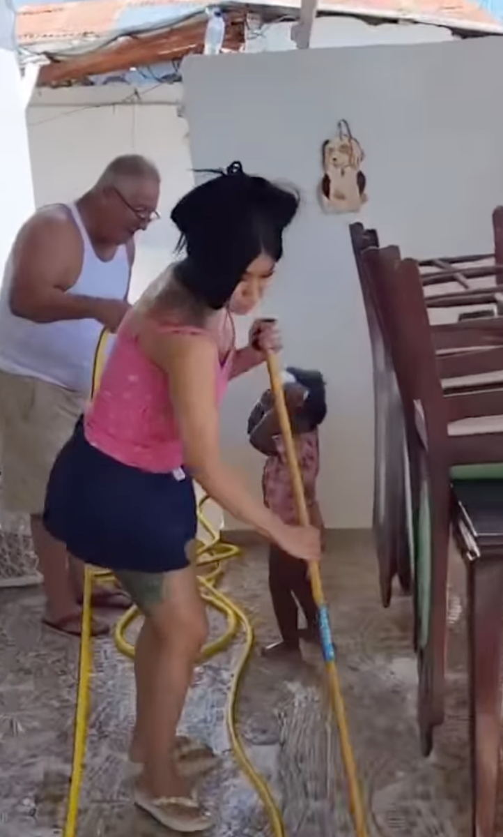 Cardi B may be one of the biggest names in hip-hop, but when she visits her family in the Dominican Republic, she's apparently still expected to pick up a broom and get to work.