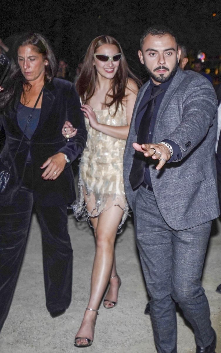 The 22-year-old actress, who playes Belly in the hit Amazon Prime drama, turned heads in a nude Blumarine embellished mini dress paired with quirky Balenciaga sunglasses. 