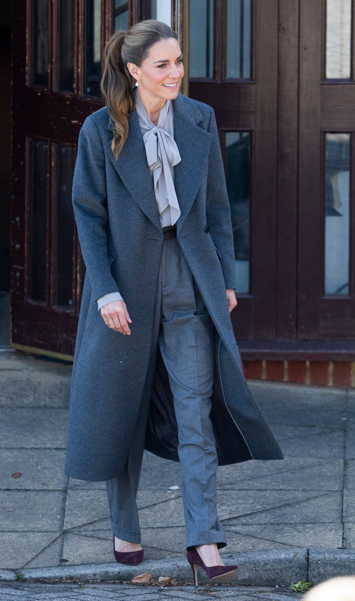 The wine-colored accessories warm everything up and create contrast without competing with the tailoring.