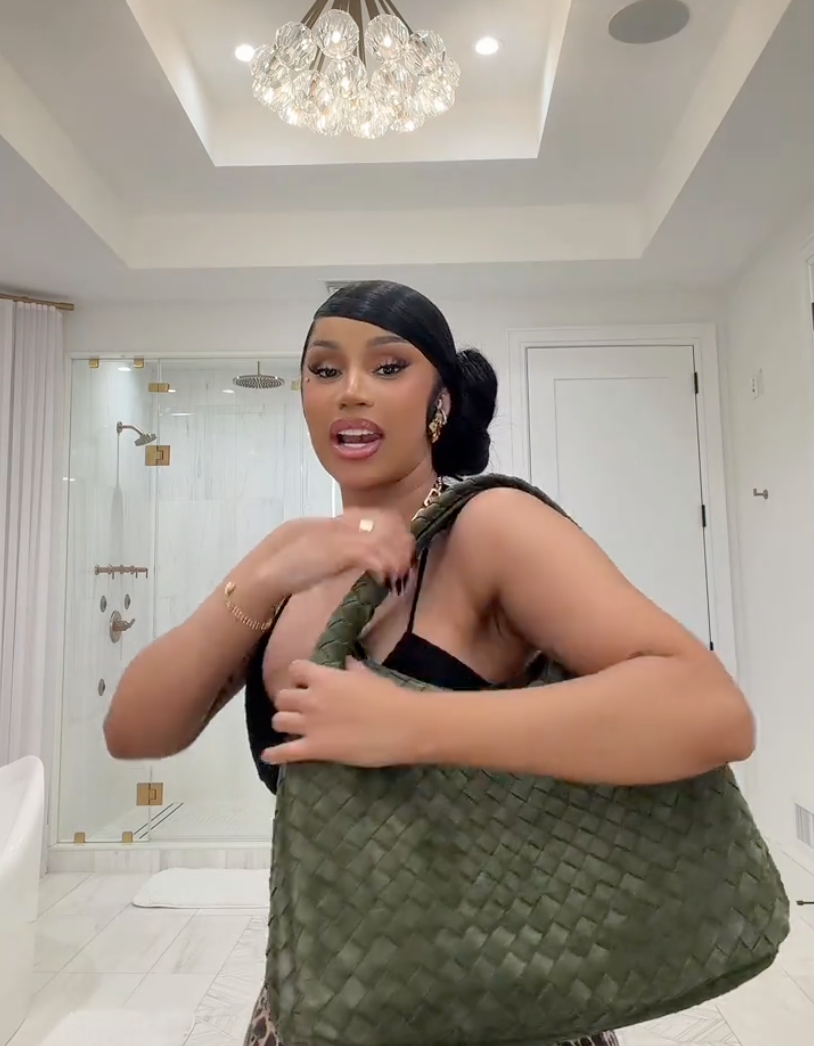 Cardi has a Bottega Veneta in a forest-green tweed Large Campana shoulder bag reportedly priced at around $6,700. 