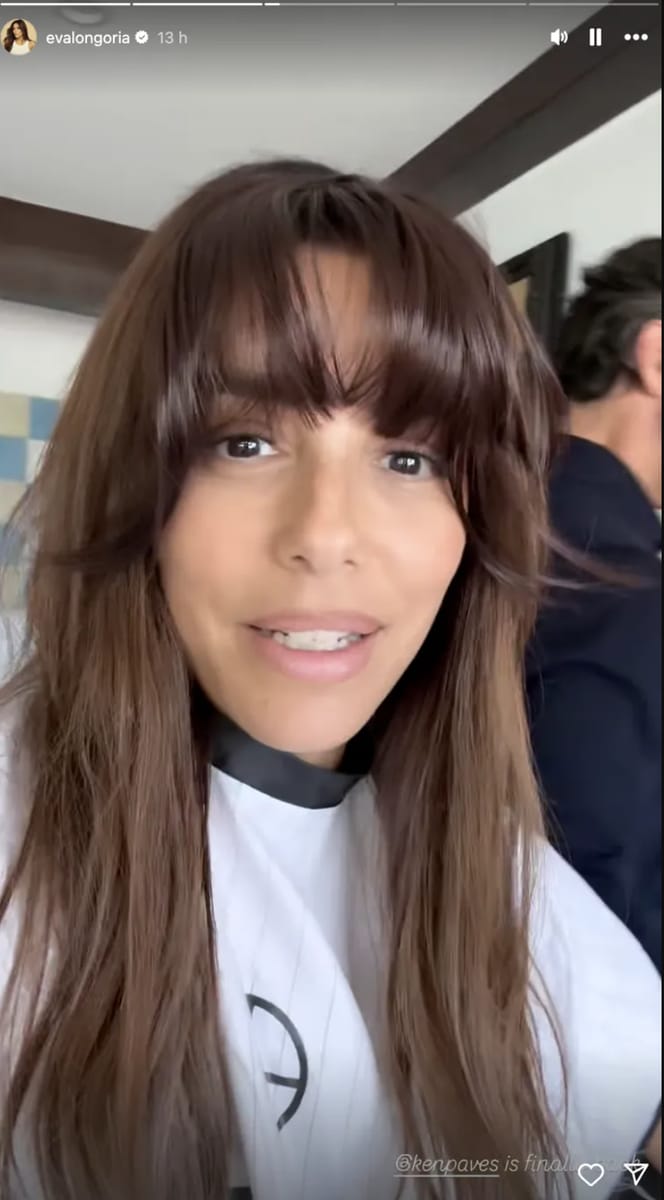 Eva with a dramatic hairpiece that gave her a full set of blunt bangs.