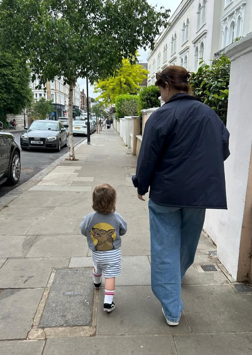 Princess Eugenie walks alongside her youngest son, Ernest, during a family outing.