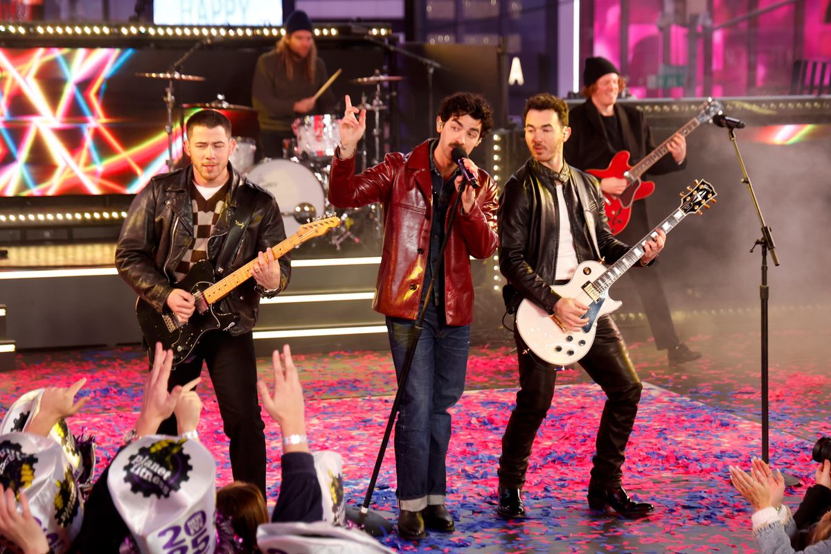 Nick Jonas, Joe Jonas and Kevin Jonas of The Jonas Brothers on stage