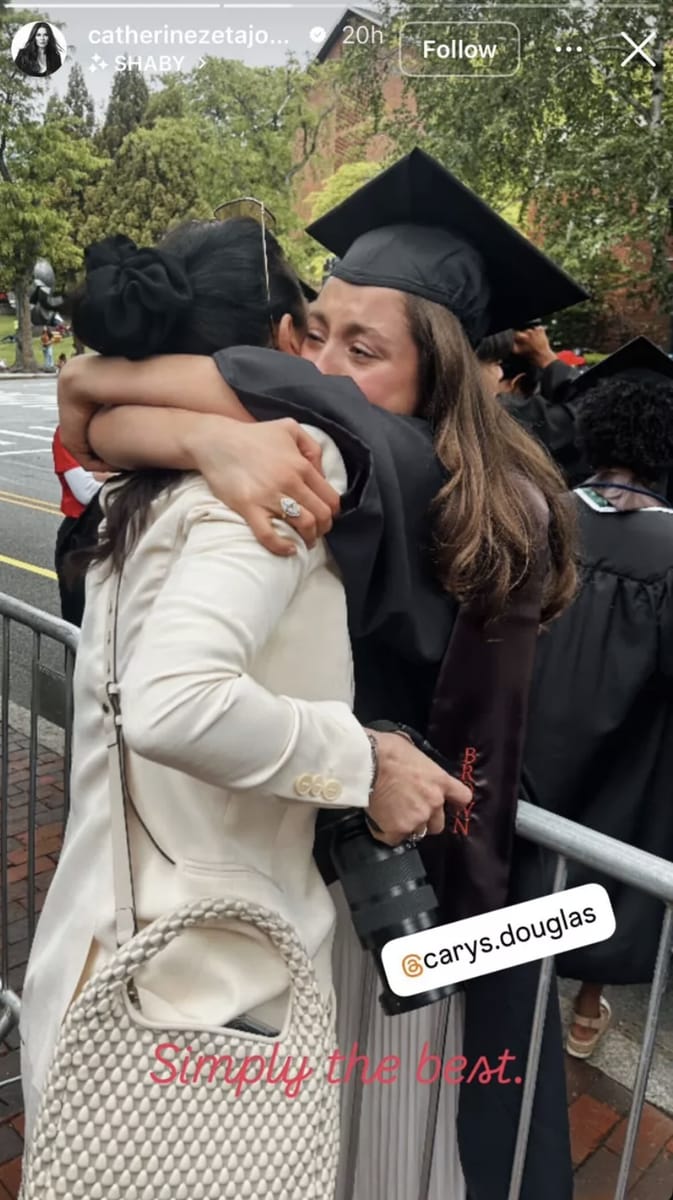 Carys and her mother hugging as she prepares to step onstage for her graduation ceremony