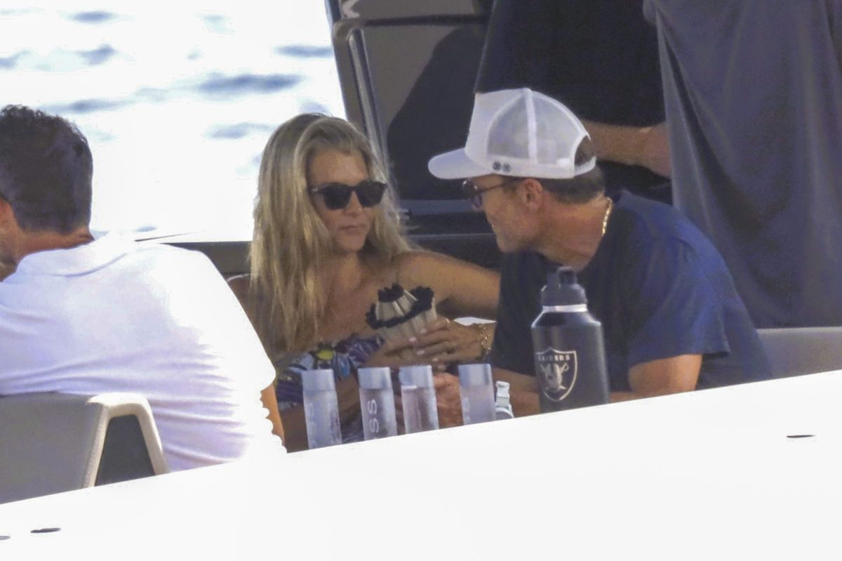 The mysery woman stayed close to Brady throughout the afternoon