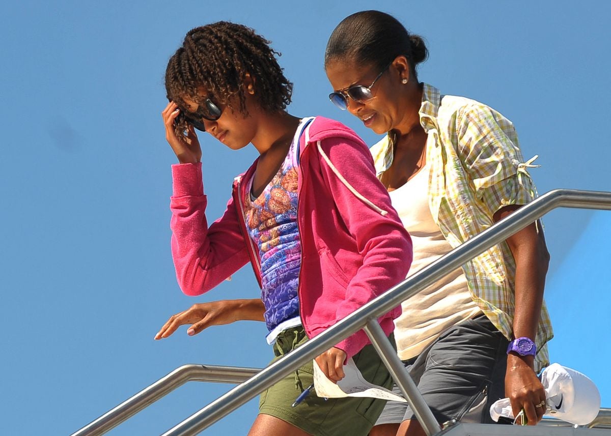 First Lady Michelle Obama and daughter Malia step off Air Force One August 16, 2009 