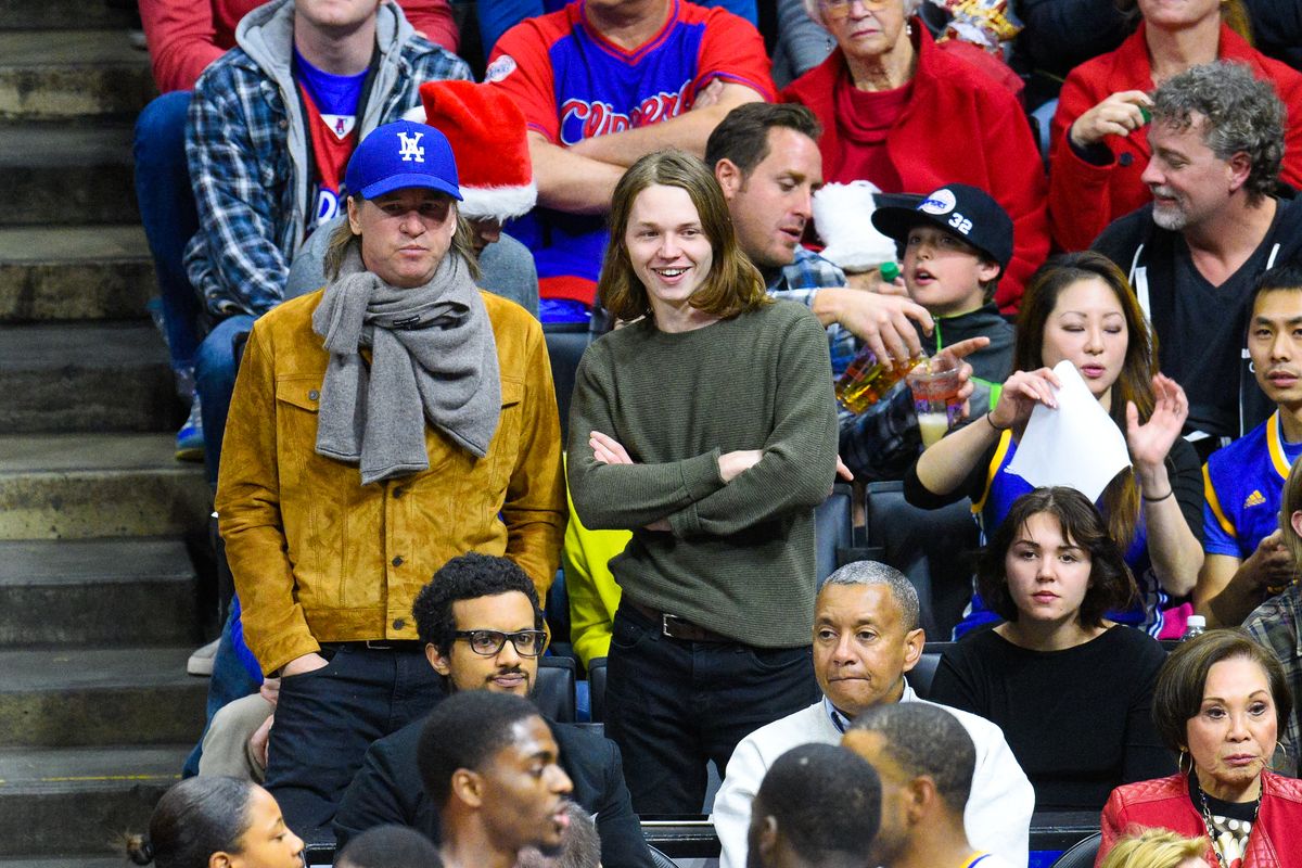  (L-R) Val Kilmer, Jack Kilmer, and Mercedes Kilmer attend a basketball game on Christmas between the Golden State Warriors and the Los Angeles Clippers at Staples Center on December 25, 2014, in Los Angeles, California.  