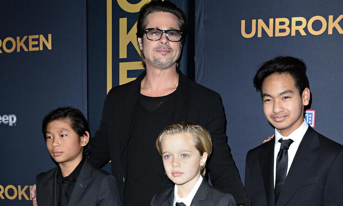 Brad Pitt posing with children Shiloh, Pax and Maddox