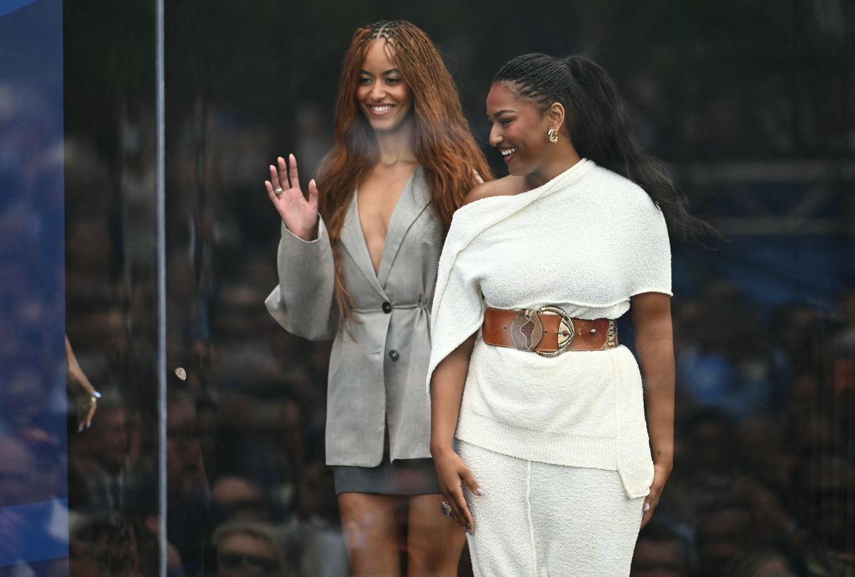 Malia and Sasha Obama make a stylish, rare appearance as the family reunites at the Obama Center
