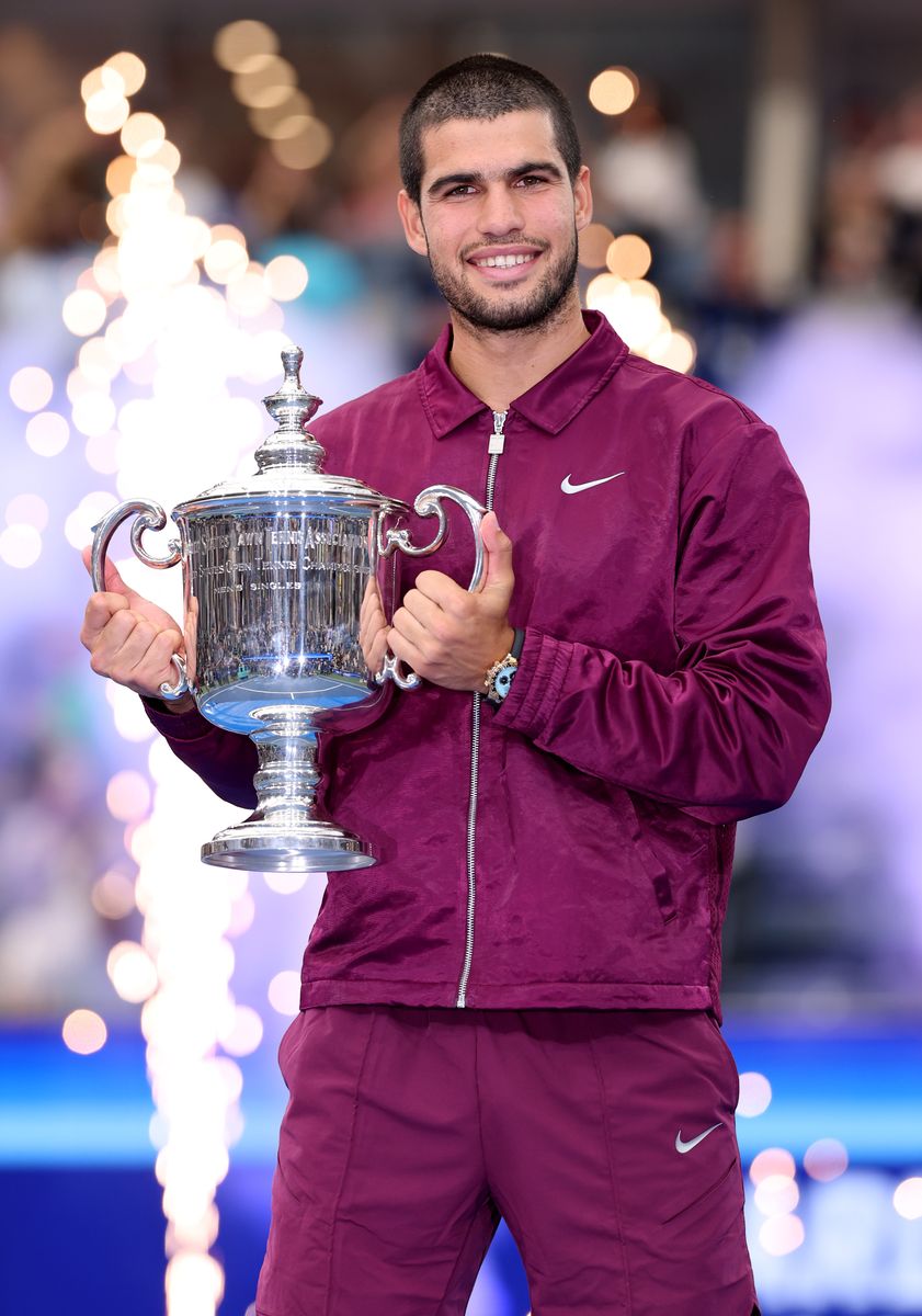 Carlos Alcaraz celebrates with the trophy after defeating Jannik Sinner in the 2025 US Open men’s singles final in New York
