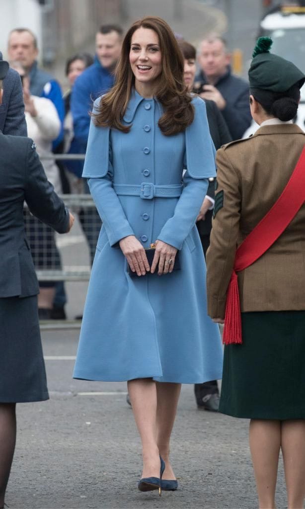 Kate Middleton in a blue coat dress with cape
