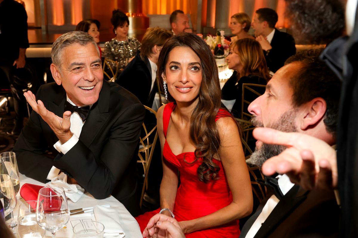 George Clooney, Amal Clooney, and Adam Sandler attend the 83rd Annual Golden Globe Awards 
