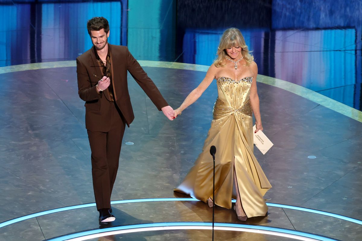 Andrew Garfield and Goldie Hawn speak onstage during the 97th Annual Oscars 