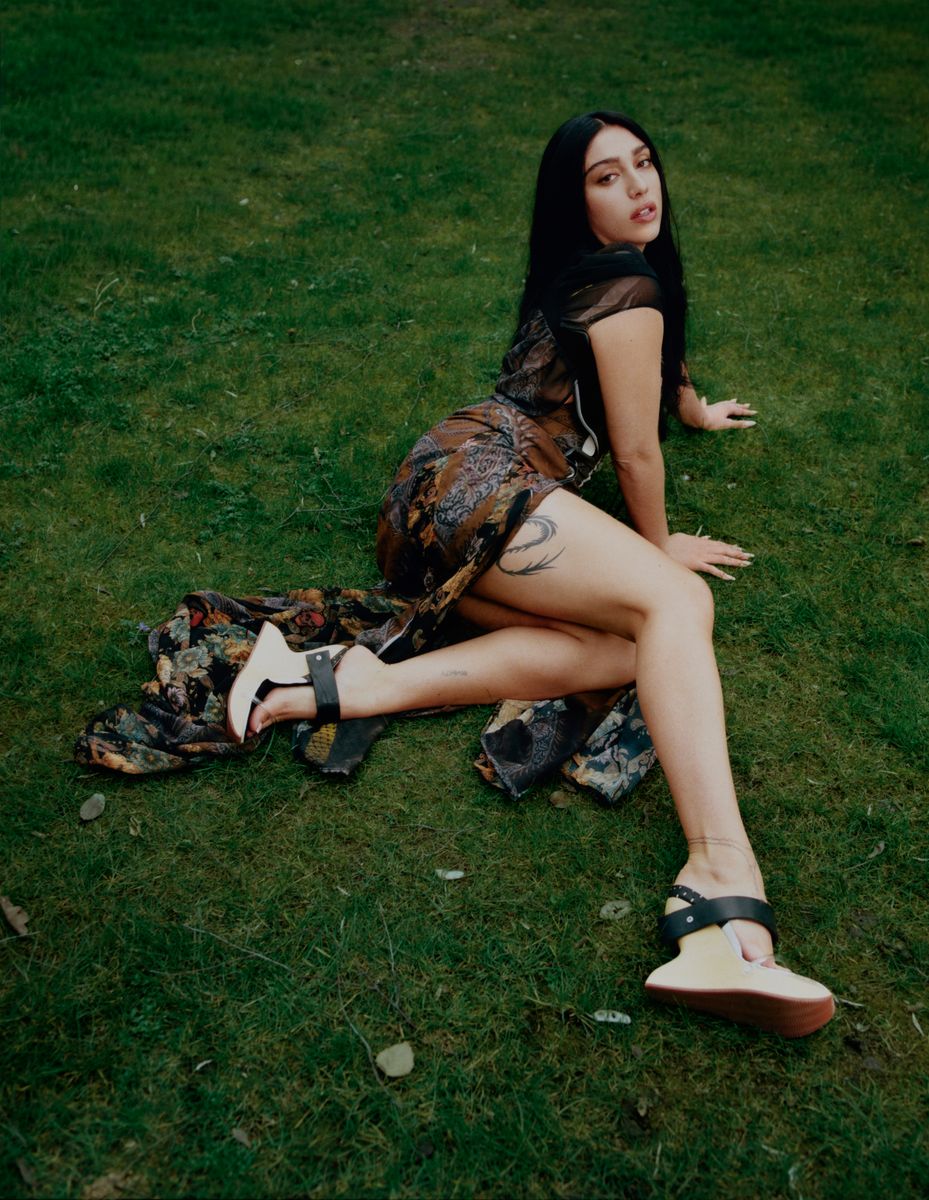 Lourdes' beauty look followed suit. Her hair fell long and unstructured, slightly tousled. Her skin appeared luminous and minimally worked, with subtle contouring and barely-there color.