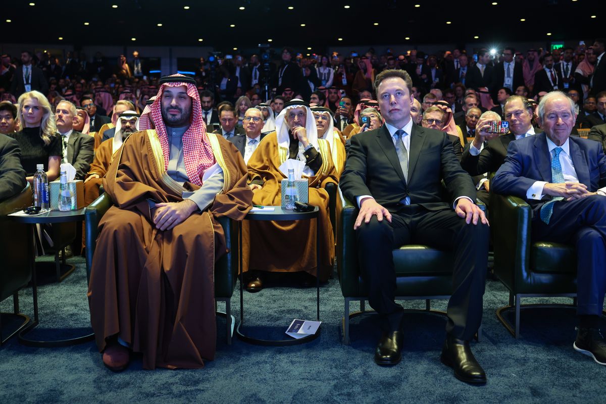 Elon Musk sits with Crown Prince and Prime Minister Mohammed bin Salman of Saudi Arabia as U.S. President Donald Trump delivers remarks at the U.S.-Saudi Investment Forum