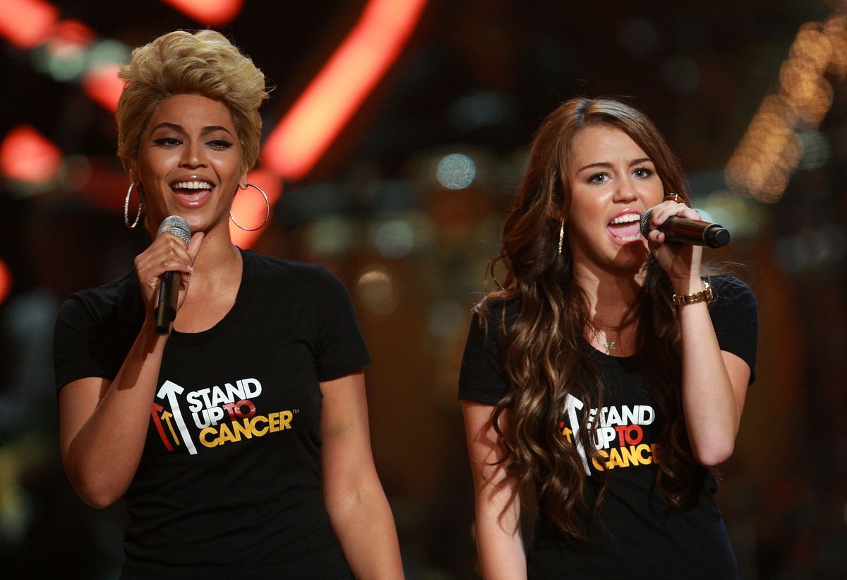 Beyonce and Miley Cyrus perform on stage during the Conde Nast Media Group's Fifth Annual Fashion Rocks at Radio City Music Hall on September 5, 2008