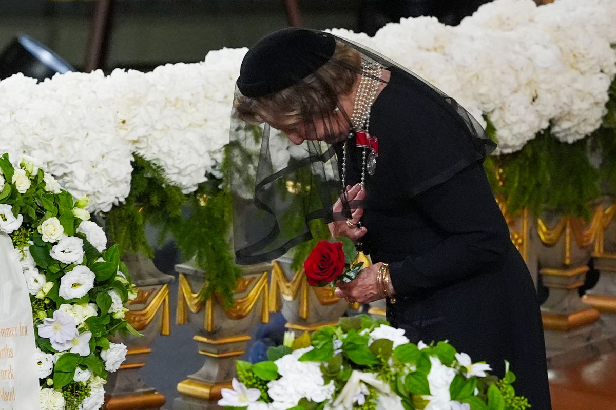 Norway's Queen Sonja places a rose on the coffin of her late husband, King Harald V, during his state funeral ceremony at Oslo Cathedral in Oslo, Norway, on September 9, 2026.