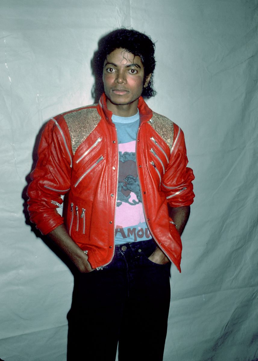 	Michael Jackson at the Dreamgirls after-party. Jackson is wearing his soon-to-be iconic J. Park red leather zipper jacket, made famous in his 'Beat It' video, which aired 11 days later on MTV.  