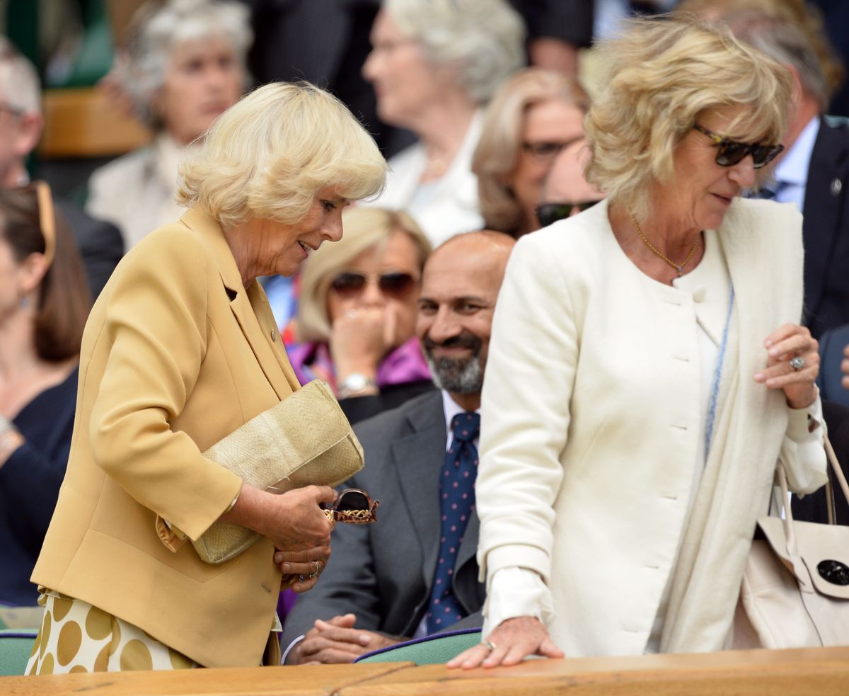 LONDON, ENGLAND - JUNE 25:  Camilla, Duchess of Cornwall and her sister Annabel Elliot attend the Casey Dellacqua v Agnieszka Radwanska match on centre court during day three of the Wimbledon Championships at Wimbledon on June 25, 2014 in London, England.  (Photo by Karwai Tang/WireImage)