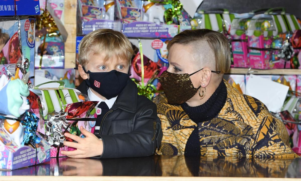 Prince Jacques helped his mom pass out toys on Dec. 16 at the palace