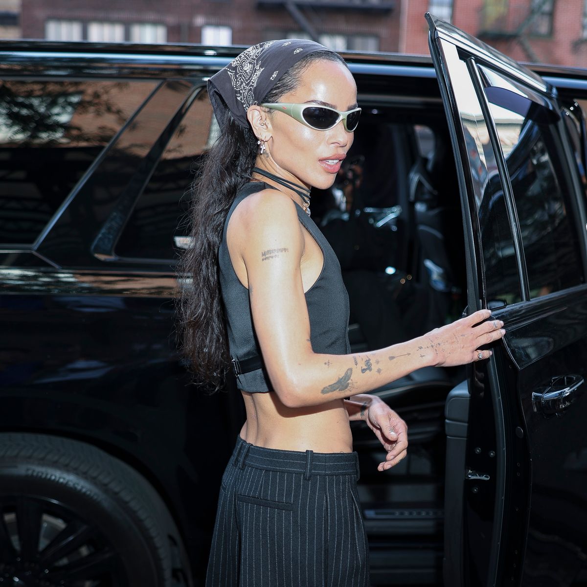 Zoe Kravitz played it cool, pairing the piece with diamond hoops.