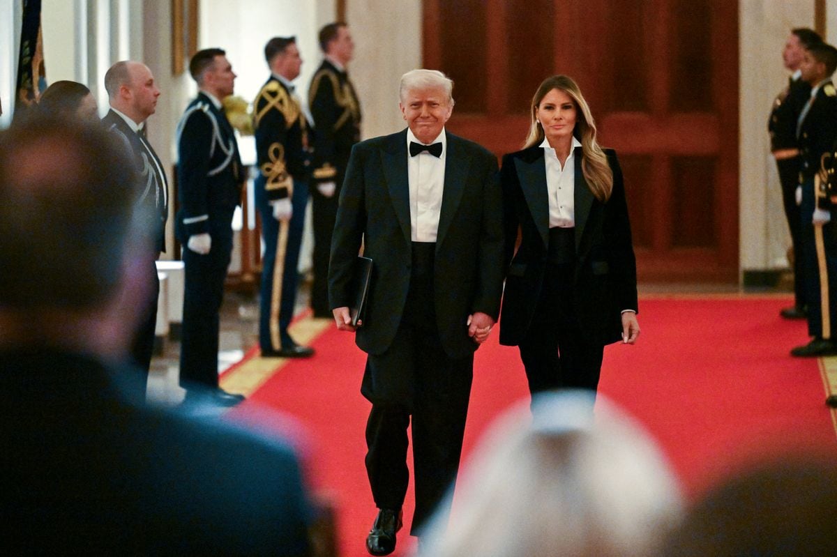 Donald Trump and Melania Trump arrive for the National Governors Association Evening Dinner and Reception in the East Room of the White House