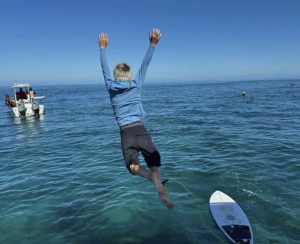 Hemsworth shared photos of his sons enjoying the ocean