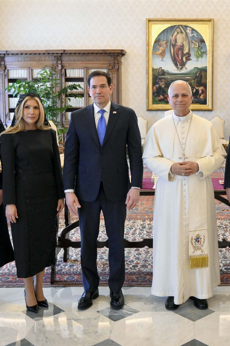 Pope Leo XIV poses with U.S. Secretary Of State Marco Rubio and his wife Jeanette Dousdebes Rubio during an audience at the Apostolic Palace