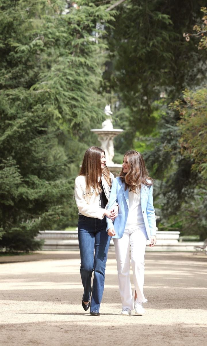 The royal sisters were photographed sweetly strolling arm-in-arm.