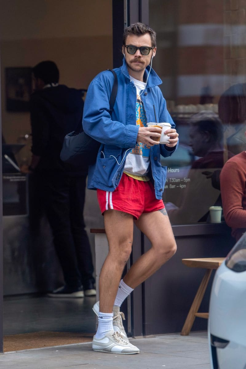 Harry Styles wearing his favorite pair of red shorts in London