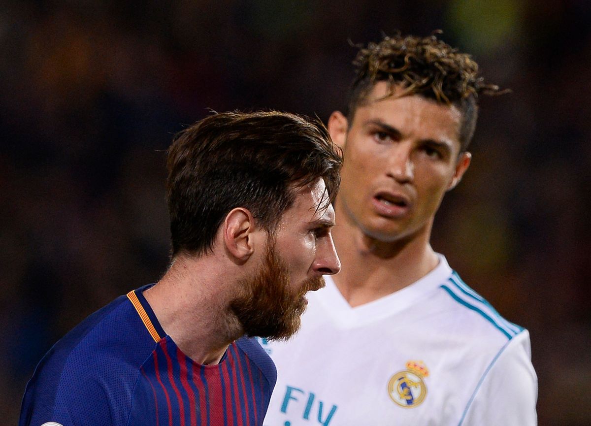 Real Madrid's Portuguese forward Cristiano Ronaldo (R) looks at Barcelona's Argentinian forward Lionel Messi during the Spanish league football match between FC Barcelona and Real Madrid CF