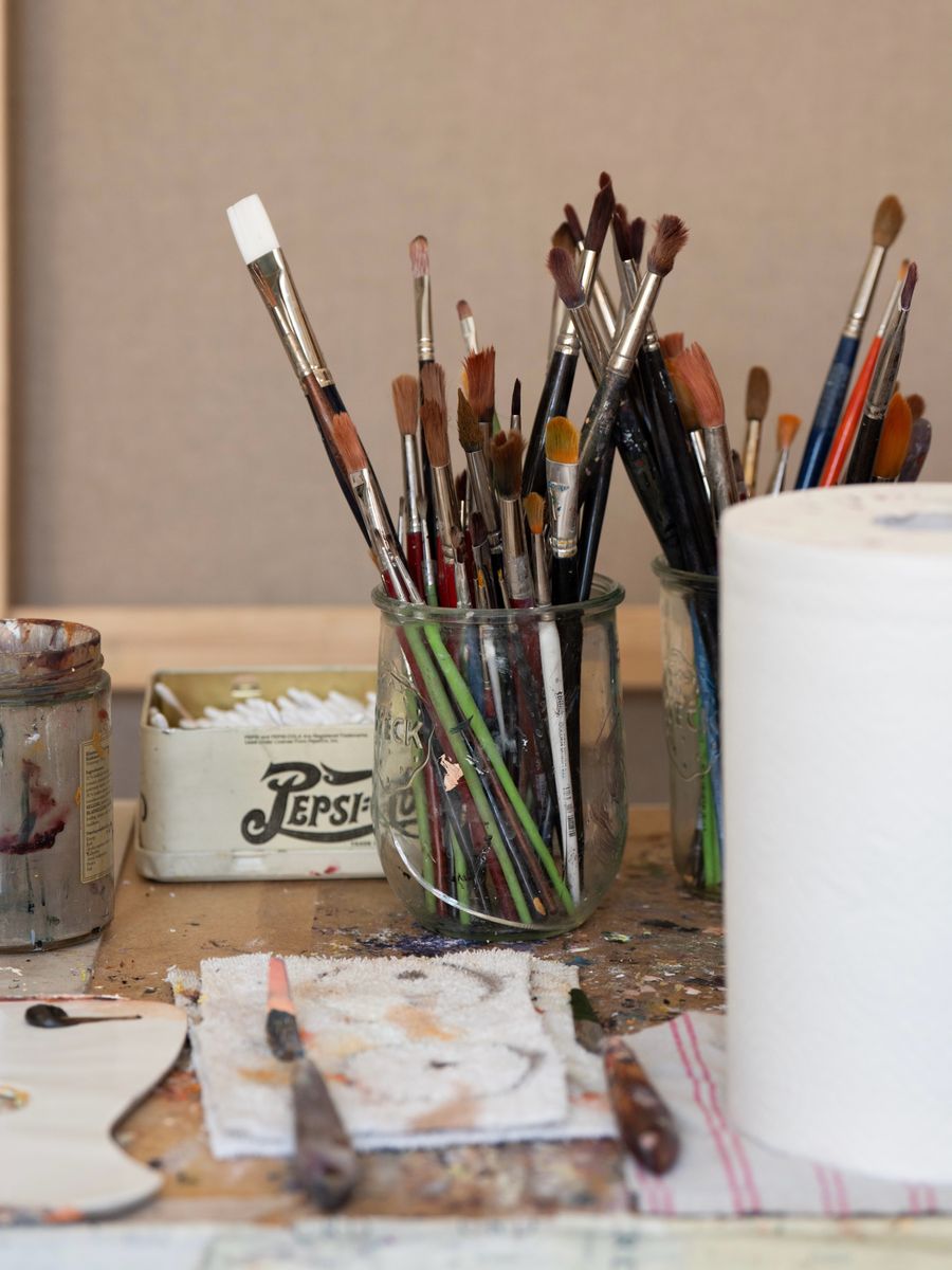 Paintbrushes and art supplies offer a behind-the-scenes glimpse into the creation of the King’s new portrait.