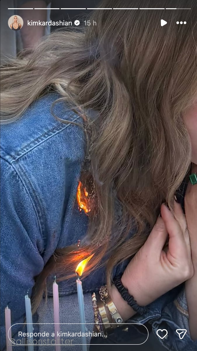 Someone standing close to her immediately noticed and reached in to put out the fire. 