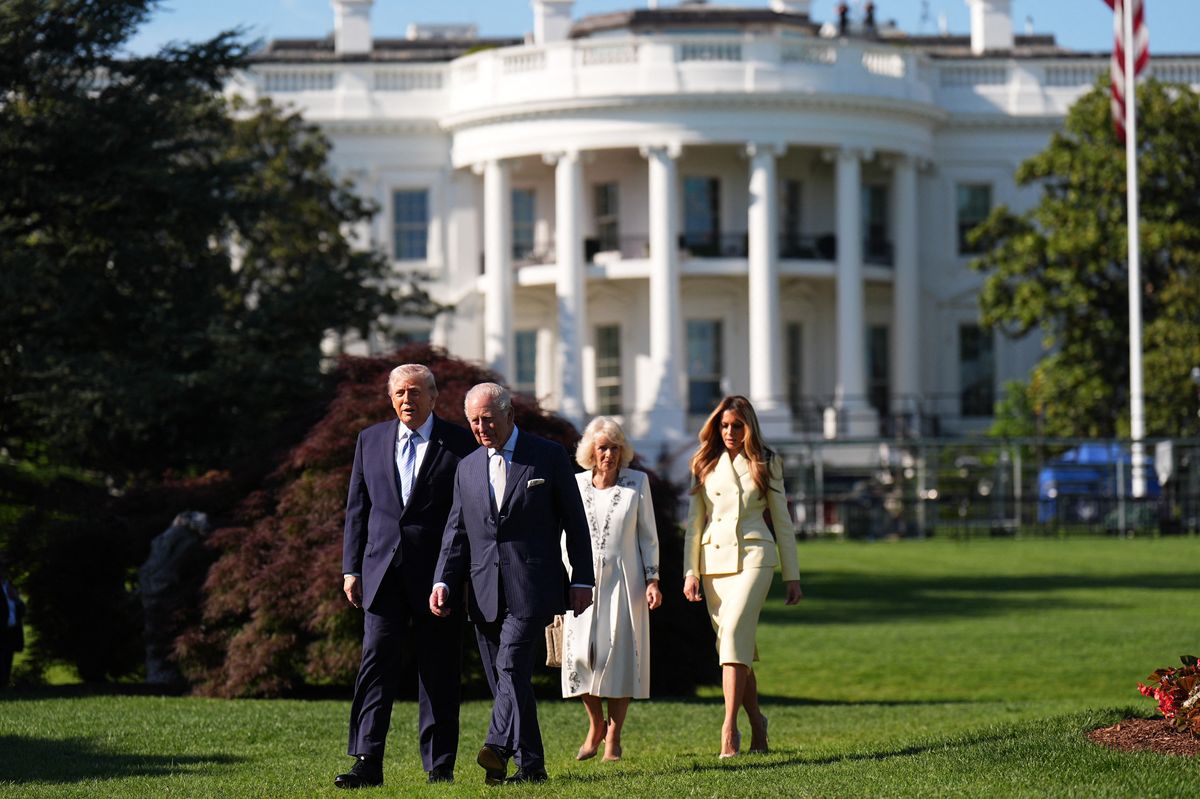 US President Donald Trump, First Lady Melania Trump, Britain's King Charles III and Britain's Queen Camilla walk to the White House beehive on the South Lawn of the White House