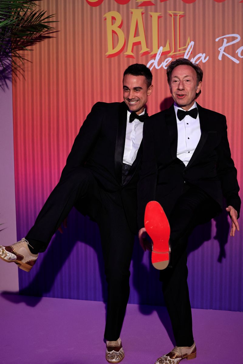 French TV host Stephane Bern (R) and his partner Yori Bailleres (L) 