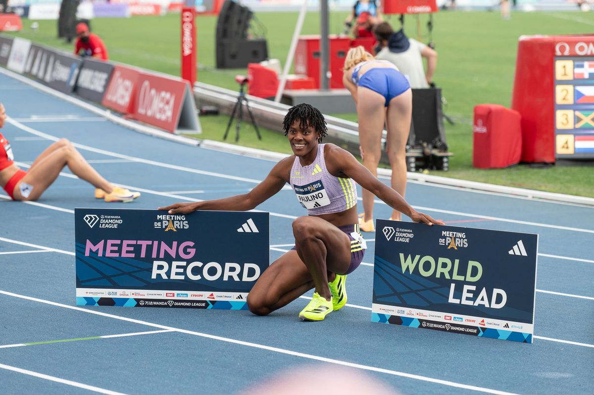 Marileidy Paulino of the Dominican Republic celebrates winning the race and setting a meeting record in the women's 400m during the Meeting of Paris