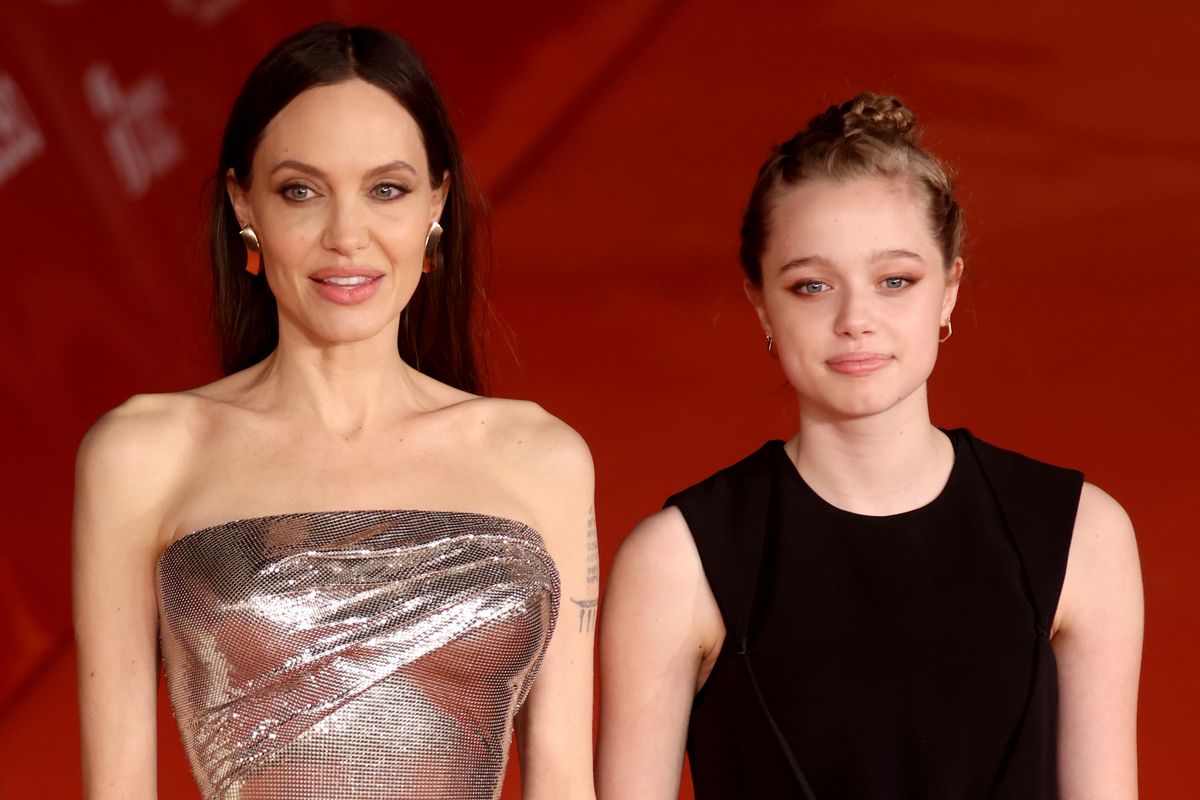 In 2021, Shiloh supported her mom at the premiere of "Eternals." For the premiere, she wore a black dress with her hair, in a longer style now, held up in a bun. 