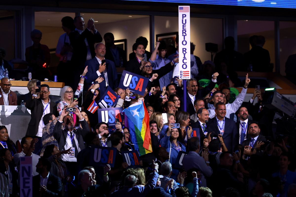  Members of the Puerto Rico delegation cast their votes during the Ceremonial Roll Call of States on the second day of the Democratic National Convention at the United Center on August 20, 2024 in Chicago, Illinois. Delegates, politicians, and Democratic Party supporters are gathering in Chicago, as current Vice President Kamala Harris is named her party's presidential nominee. The DNC takes place from August 19-22. (Photo by Joe Raedle/Getty Images)