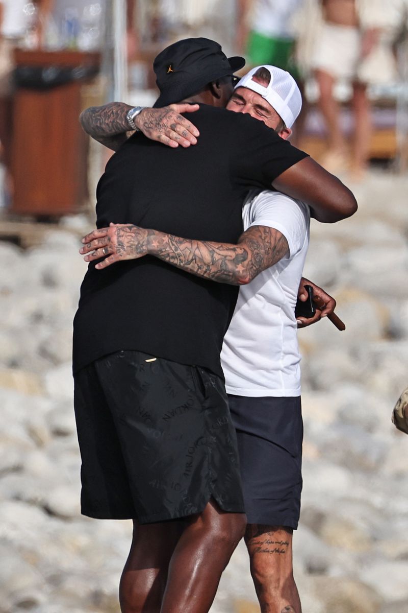 David Beckham warmly embraces Michael Jordan as the two sports legends reunite during lunch in Ibiza.