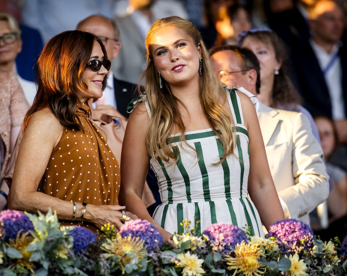 Queen Mary is all smiles in a chic polka-dot dress as Princess Amalia shines in white and emerald green