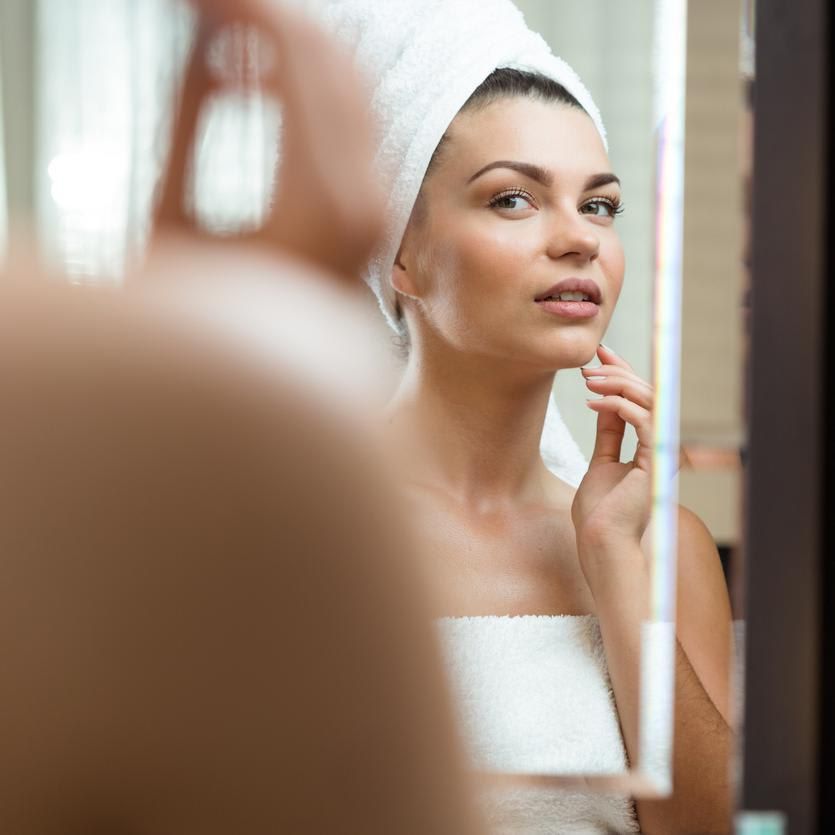 Woman looking in the mirror