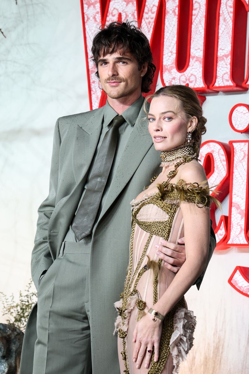 Elordi opted for a tailored all-grey ensemble at earlier appearances, later switching to a sharp dark green suit for the London premiere. 