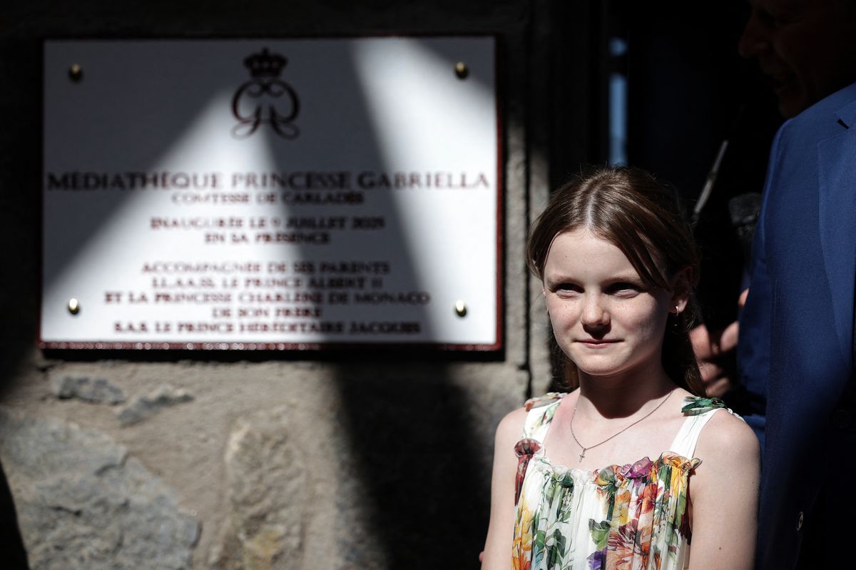 Princess Gabriella of Monaco, Countess of Carladez, stands in front of the plaque of the new media library which bears her name as part of a visit to Carladez, a former possession of the Principality of Monaco, in Mur-de-Barrez, southern France on July 9, 2025. (Photo by Valentine CHAPUIS / AFP) / NO TABLOIDS WEB & PRINT, NO DAILY MAIL, NO DAILY MAIL GROUP, NO VOICI, NO CLOSER (Photo by VALENTINE CHAPUIS/AFP via Getty Images)          