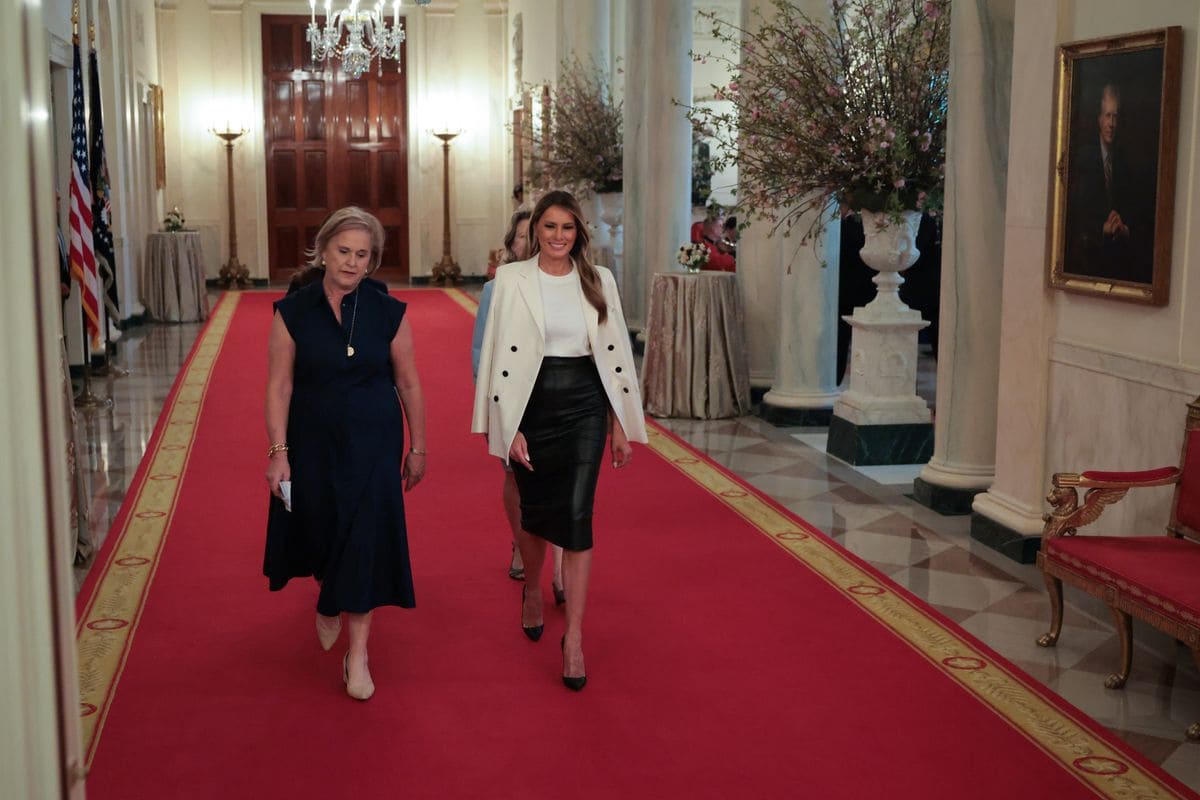 WASHINGTON, DC - MAY 08: Daughter of Barbara Bush, Dorothy Bush Koch walks alongside U.S. first lady Melania Trump into the unveiling of a U.S. Postal Service stamp honoring former first lady Barbara Bush in the East Room at the White House on May 08, 2025 in Washington, DC. The stamp honors Bush, whose husband was President George H.W. Bush, and son was President George W. Bush. Barbara Bush passed away in 2018 at the age of 92. (Photo by Kayla Bartkowski/Getty Images)