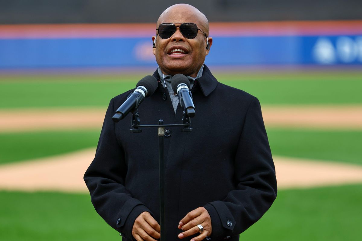 Merengue performer Rubby Pérez sings the anthem of the Dominican Republic before the baseball game between the Los Tigres del Licey and the Las Águilas Cibaeñas at Citi Field in Corona, N.Y., Sunday, Nov. 10, 