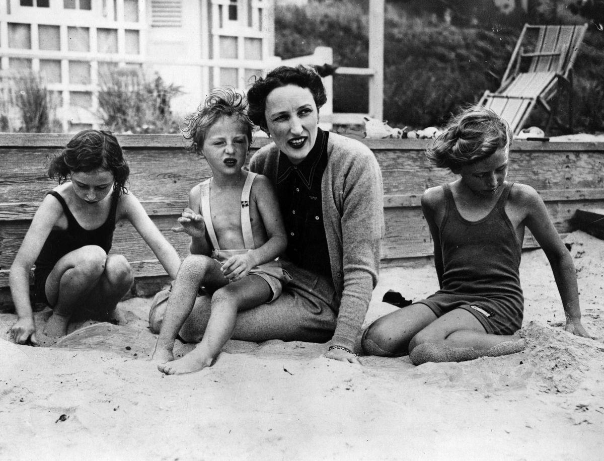 Crown Princess Martha of Norway with her three children, Astrid, aged 7, Harald, aged 3, and Ragnhild, aged 9, on the beach in America in 1940
