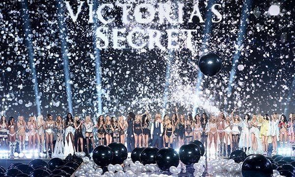 The Victoria's Secret models and performers unite amongst oversized black and white balloons for the show's finale.