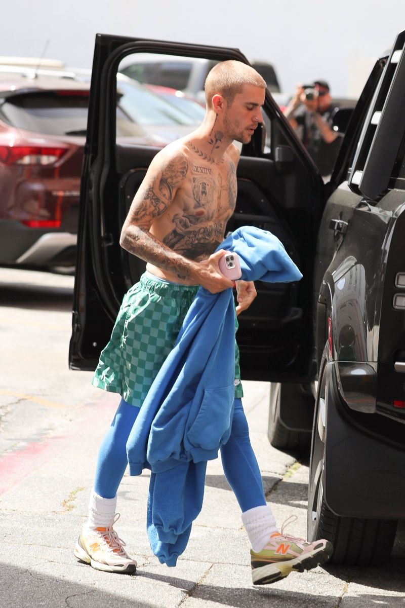 
Justin Bieber turns heads as he went shirtless during an outing in Beverly Hills, keeping it casual while visiting a medical building. 
