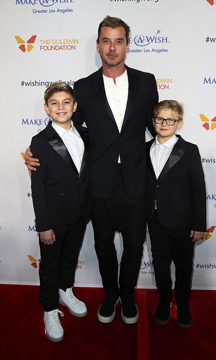 The singer had a boys' night out with his two oldest sons who wore matching suits but accessorized with POP Shoes.
Photo: David Livingston/Getty Images